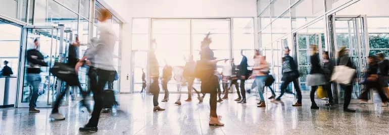 People walking around in an office building